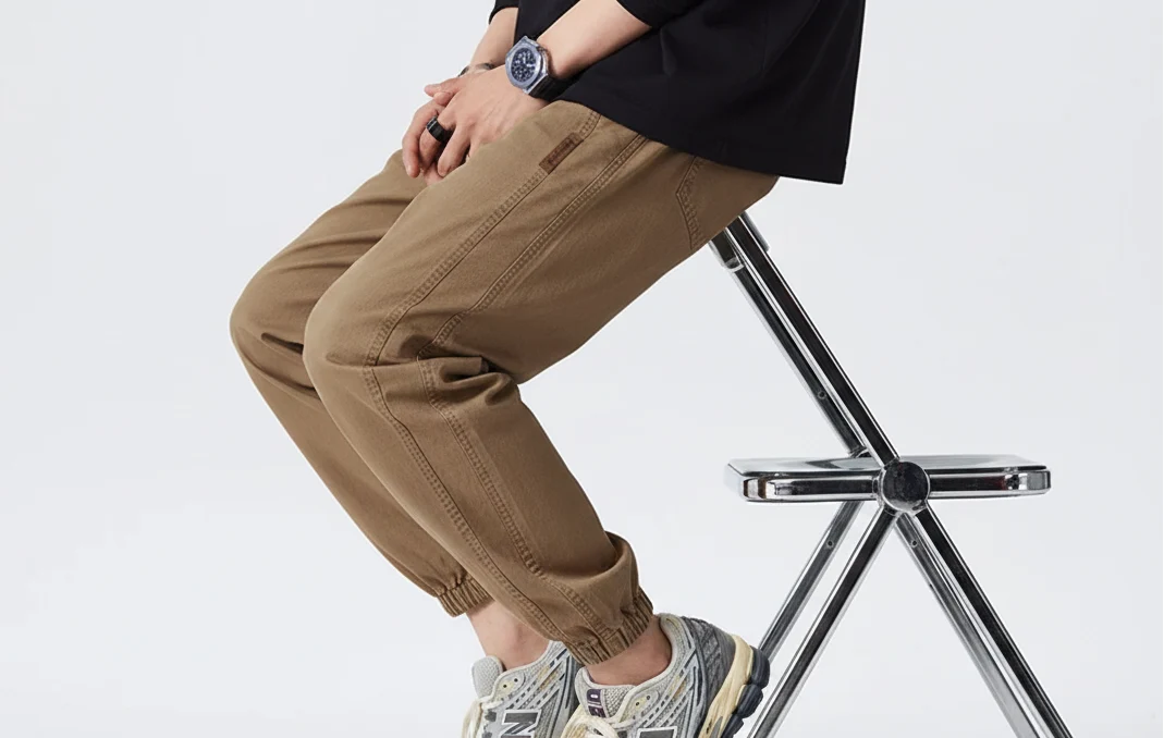 Side view of men's relaxed joggers showing comfortable fit and elasticated waistband detail