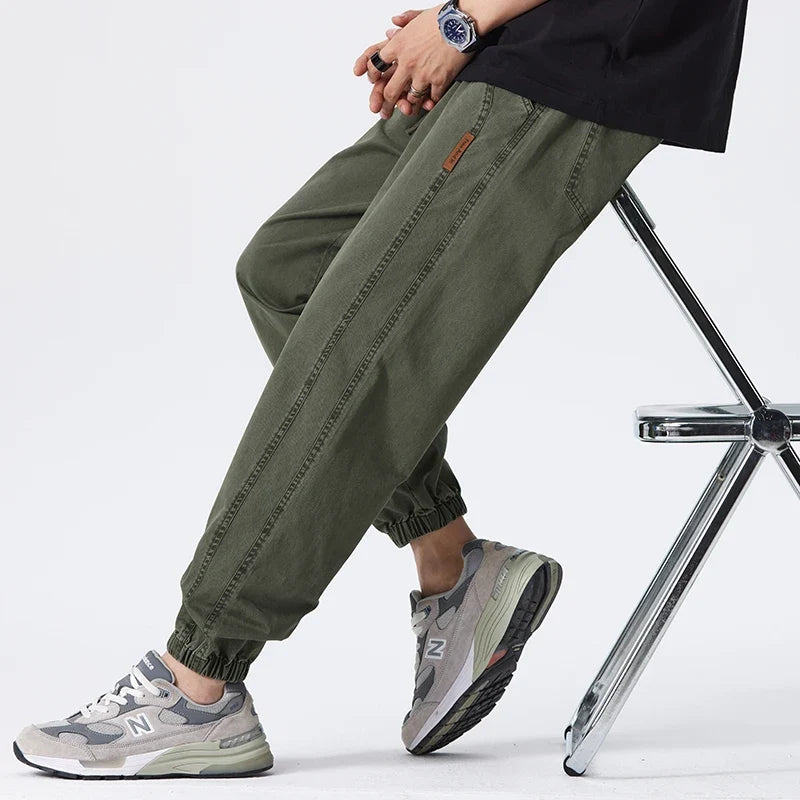 Men's relaxed joggers showcasing soft fabric drape and comfortable elasticated ankle fit