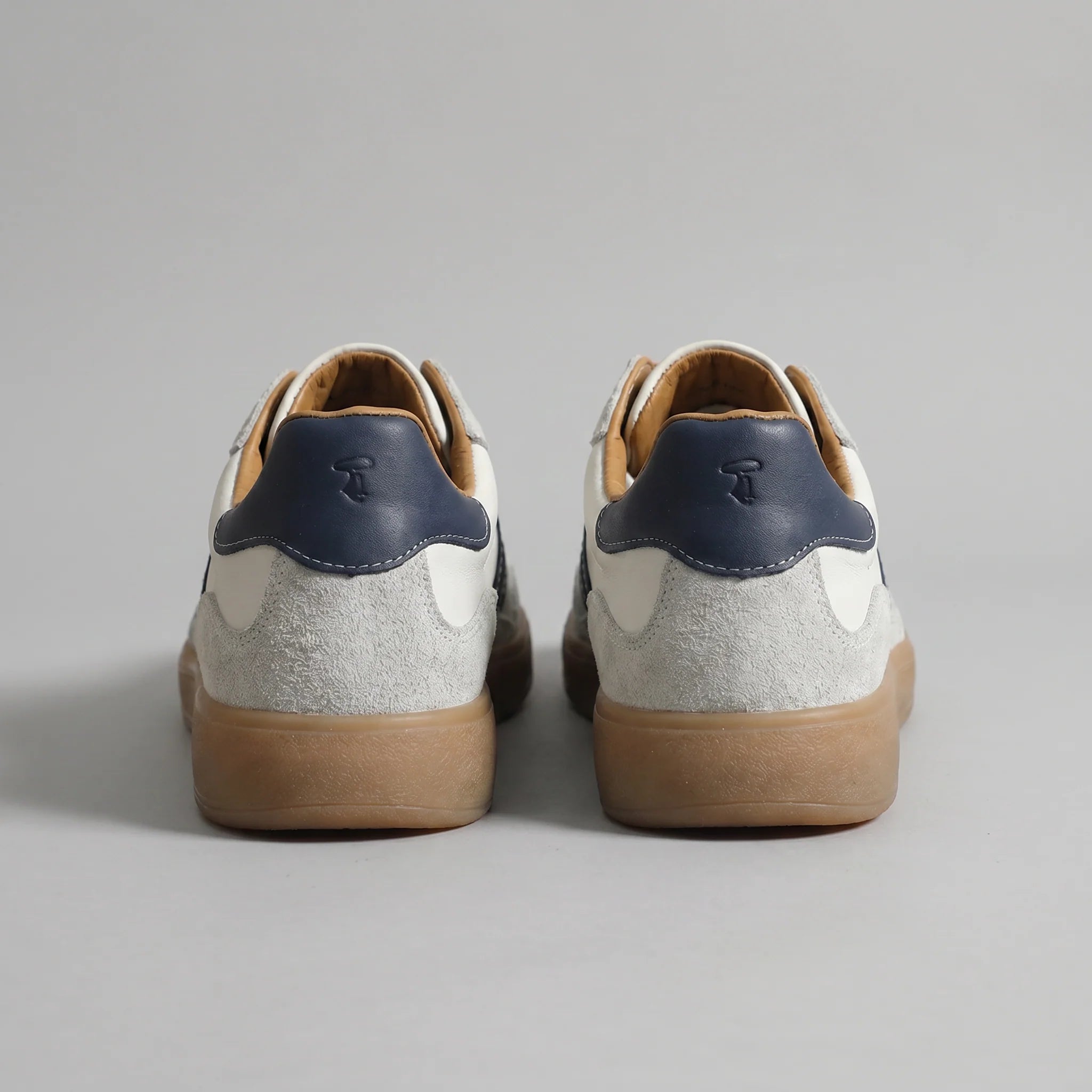 Front angled view of men's lace-up retro trainers with suede overlays