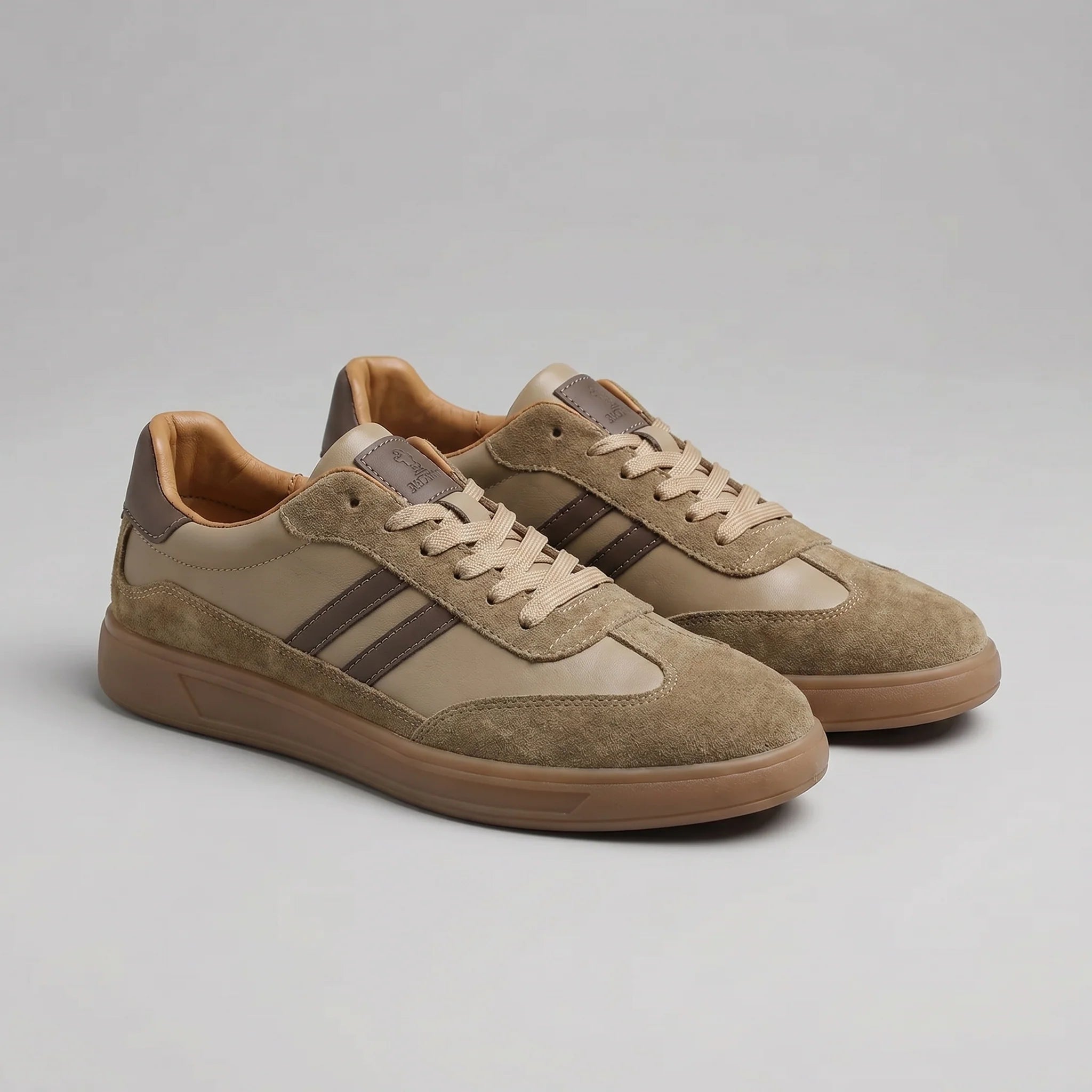 Pair of men's retro trainers displaying vintage-inspired gum sole construction