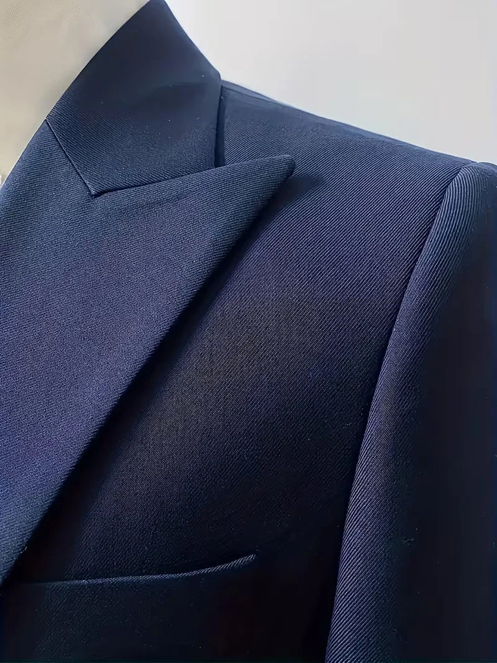 Full view of black three-piece suit set with double-breasted waistcoat centrepiece