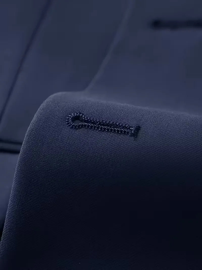 Side angle of three-piece suit showing slim-cut blazer and trouser line