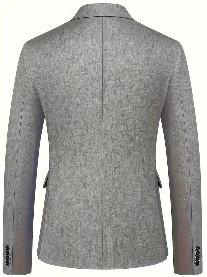 Detail of waistcoat worn under blazer with visible button detailing