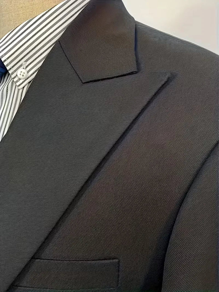 Full-length view of tailored three-piece suit set showing blazer, waistcoat, and trousers
