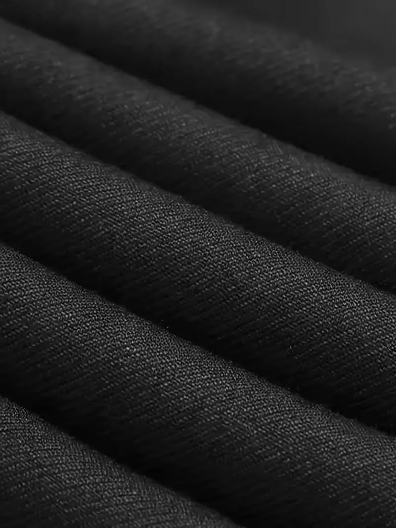 Close-up of waistcoat layered under single-breasted blazer in matching fabric