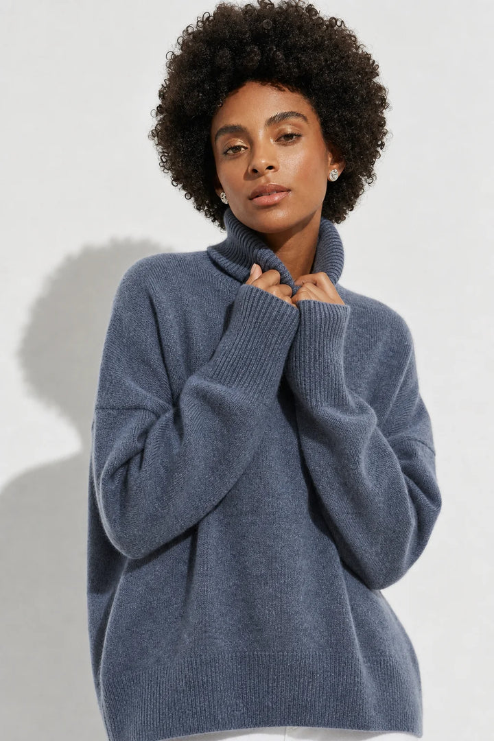Front view of the women's merino turtleneck in bark shade with generous roll neck