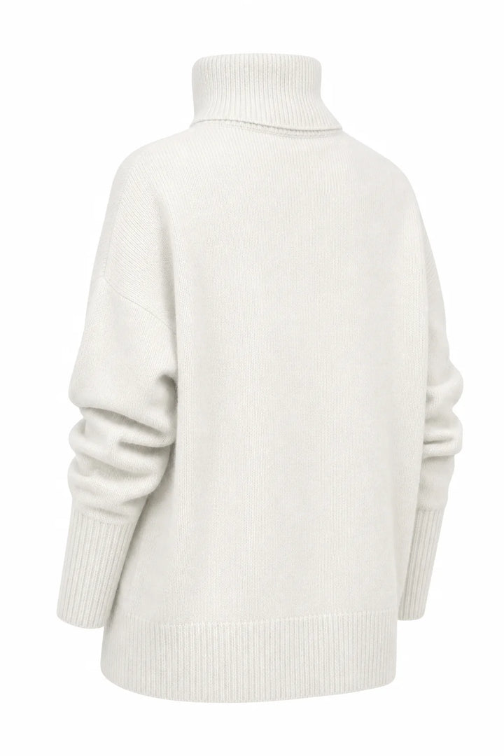 Close-up of the khaki merino turtleneck showing soft knit texture and structured roll neck