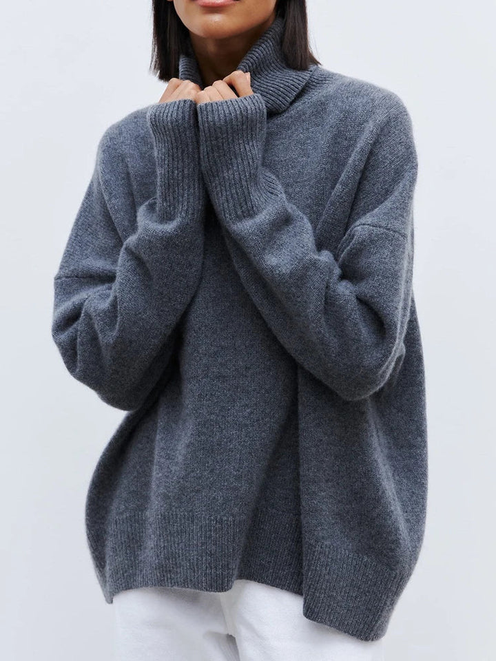 Detail shot of the dropped shoulders and ribbed cuffs on the women's merino turtleneck