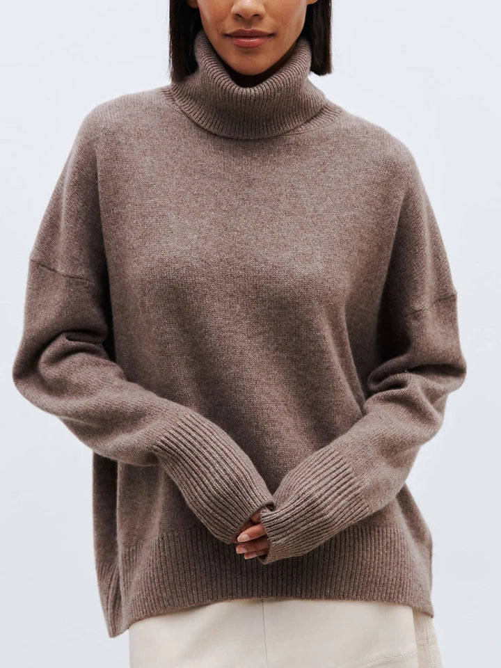 Front view of the bark shade merino turtleneck with ribbed detailing and generous fit