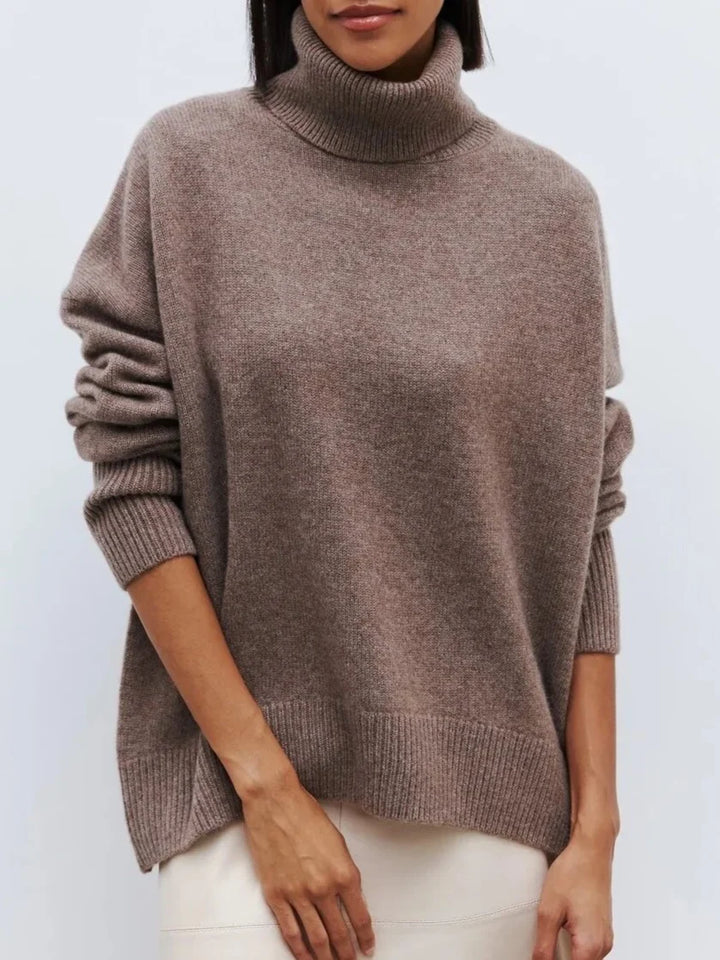 Woman styled in the white turtleneck jumper with wide-leg trousers for relaxed weekend look