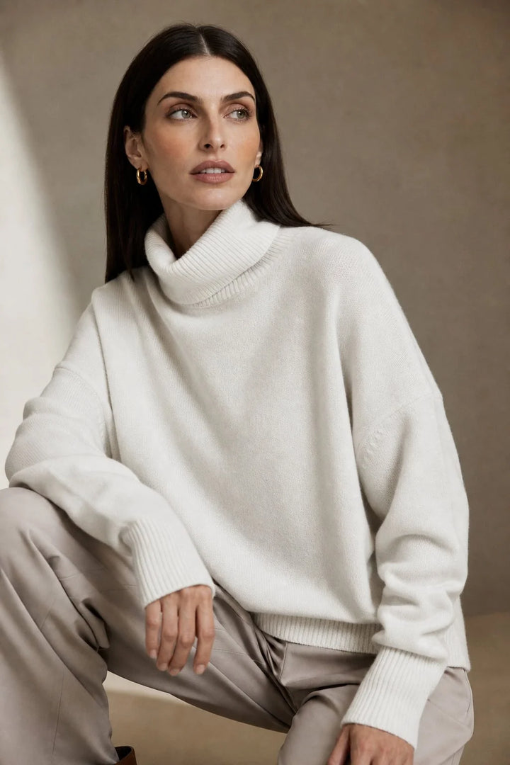 Close-up of the roll neck collar on the women's merino turtleneck jumper in soft knit