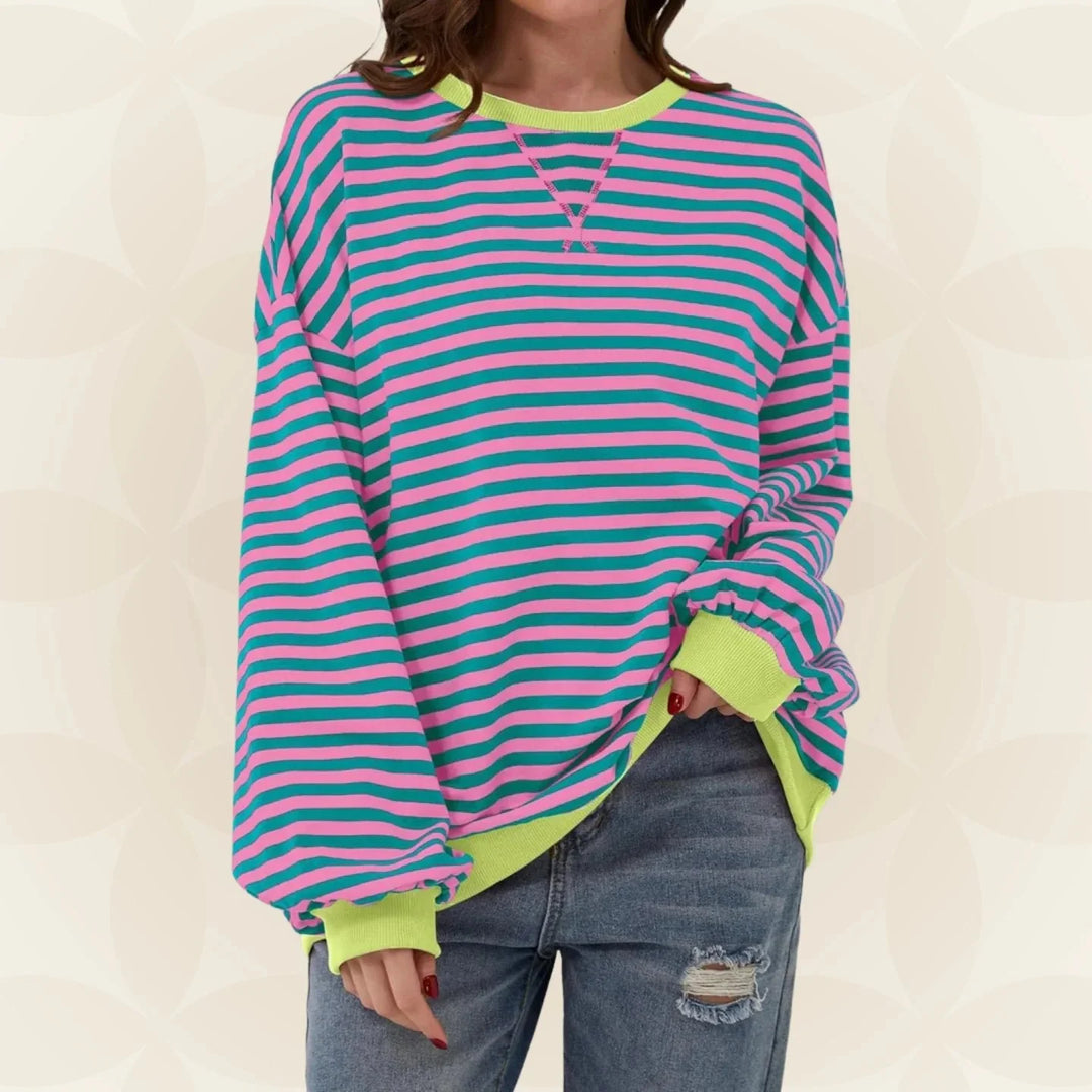 Side view of women's striped sweatshirt featuring dropped shoulders and relaxed casual silhouette
