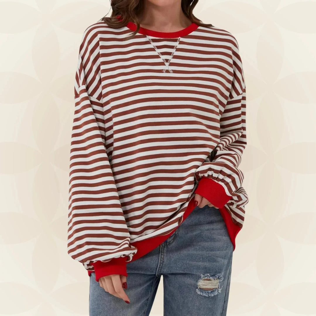 Pink and white striped women's sweatshirt showing soft knit fabric and comfortable fit