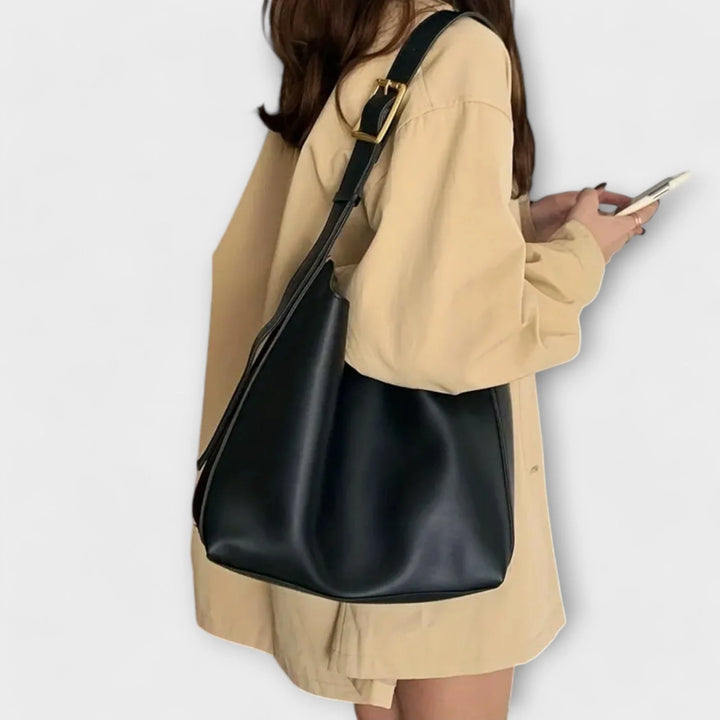 Women's shoulder bag styled for everyday wear with adjustable strap detail
