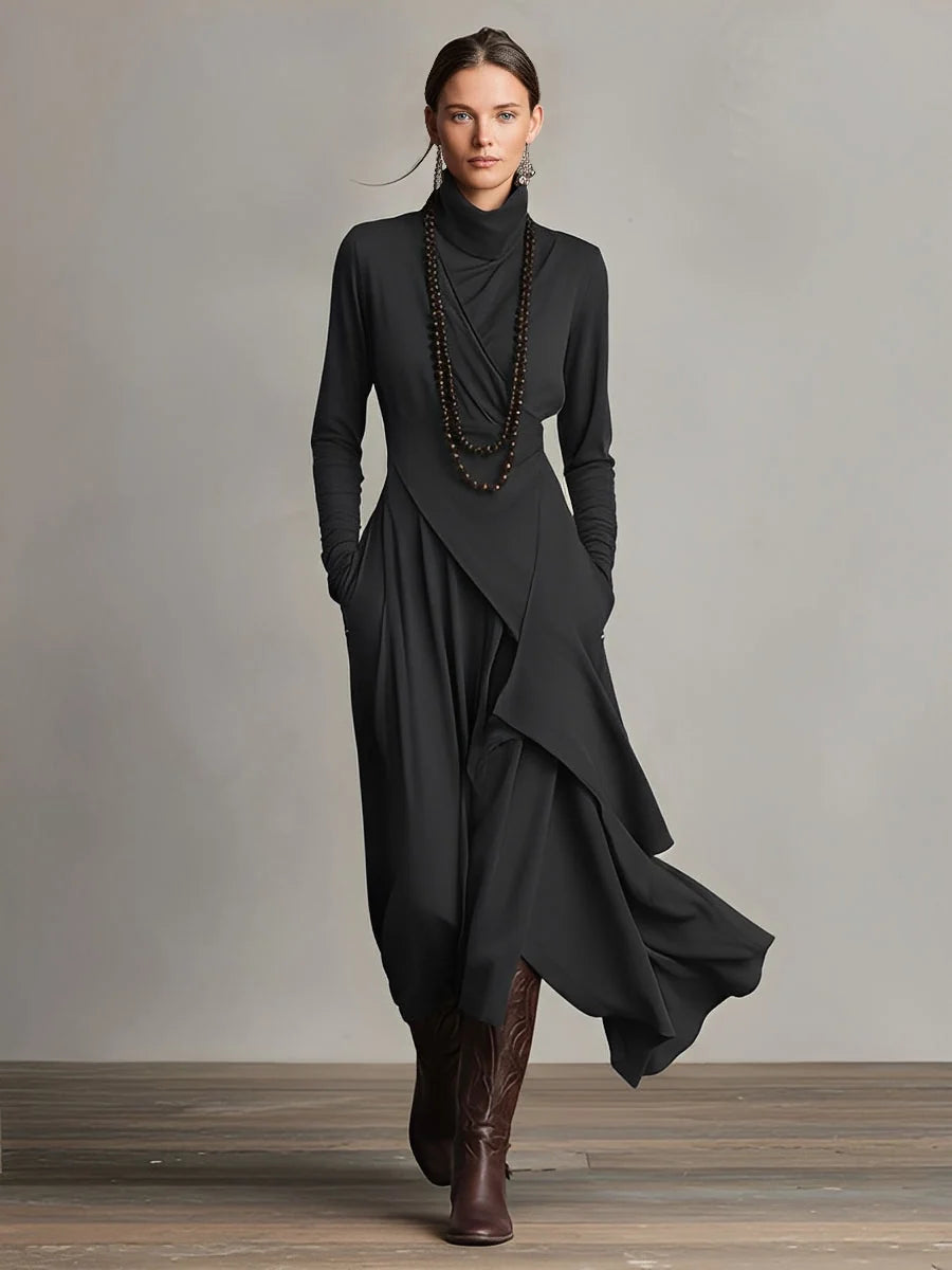 Front view of asymmetric turtleneck maxi dress showing flowing drape and floor-length hem