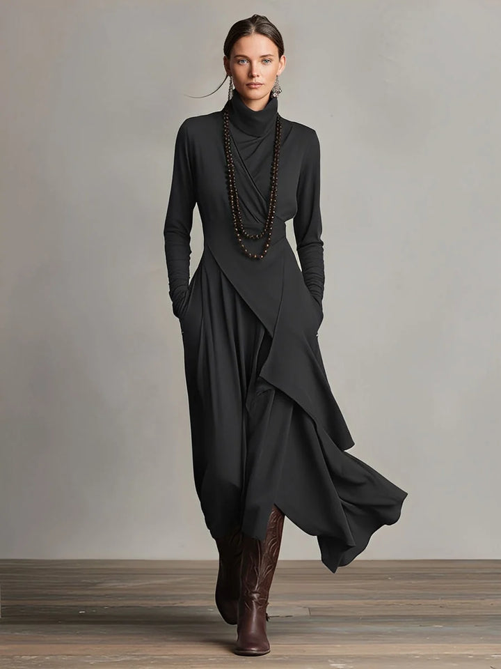 Front view of asymmetric turtleneck maxi dress showing flowing drape and floor-length hem