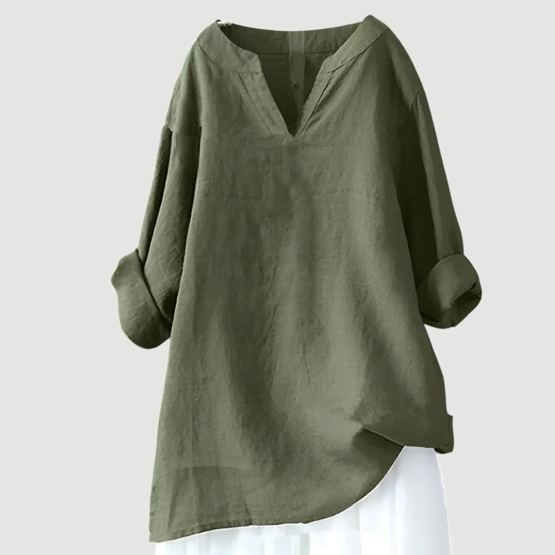 Close-up view of women's tunic showing V-neckline detail and lightweight woven fabric texture