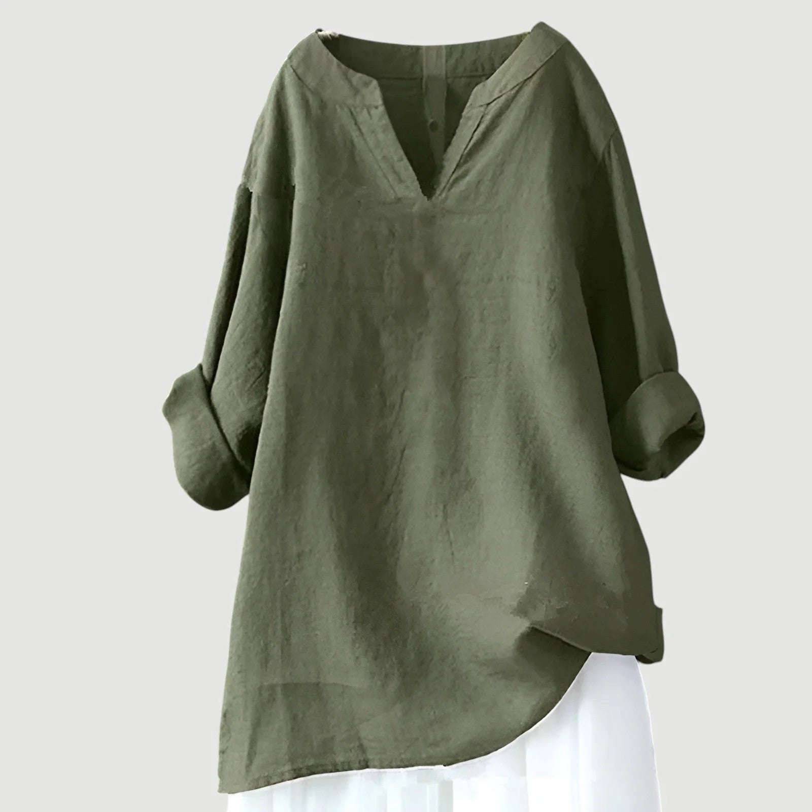 Close-up view of women's tunic showing V-neckline detail and lightweight woven fabric texture