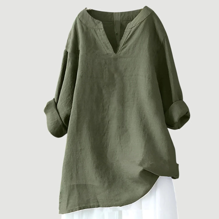 Close-up view of women's tunic showing V-neckline detail and lightweight woven fabric texture