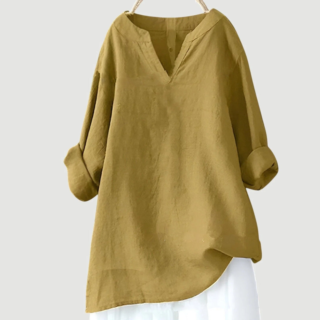 Women's long sleeve tunic in blue showcasing loose silhouette and comfortable everyday styling