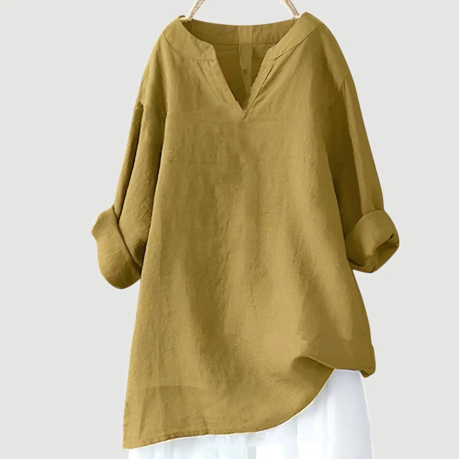 Women's long sleeve tunic in blue showcasing loose silhouette and comfortable everyday styling