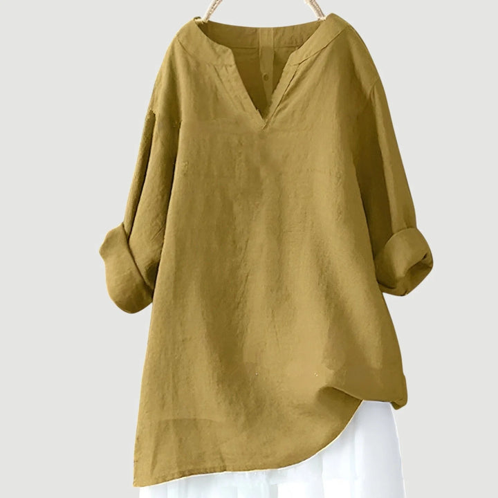 Women's long sleeve tunic in blue showcasing loose silhouette and comfortable everyday styling