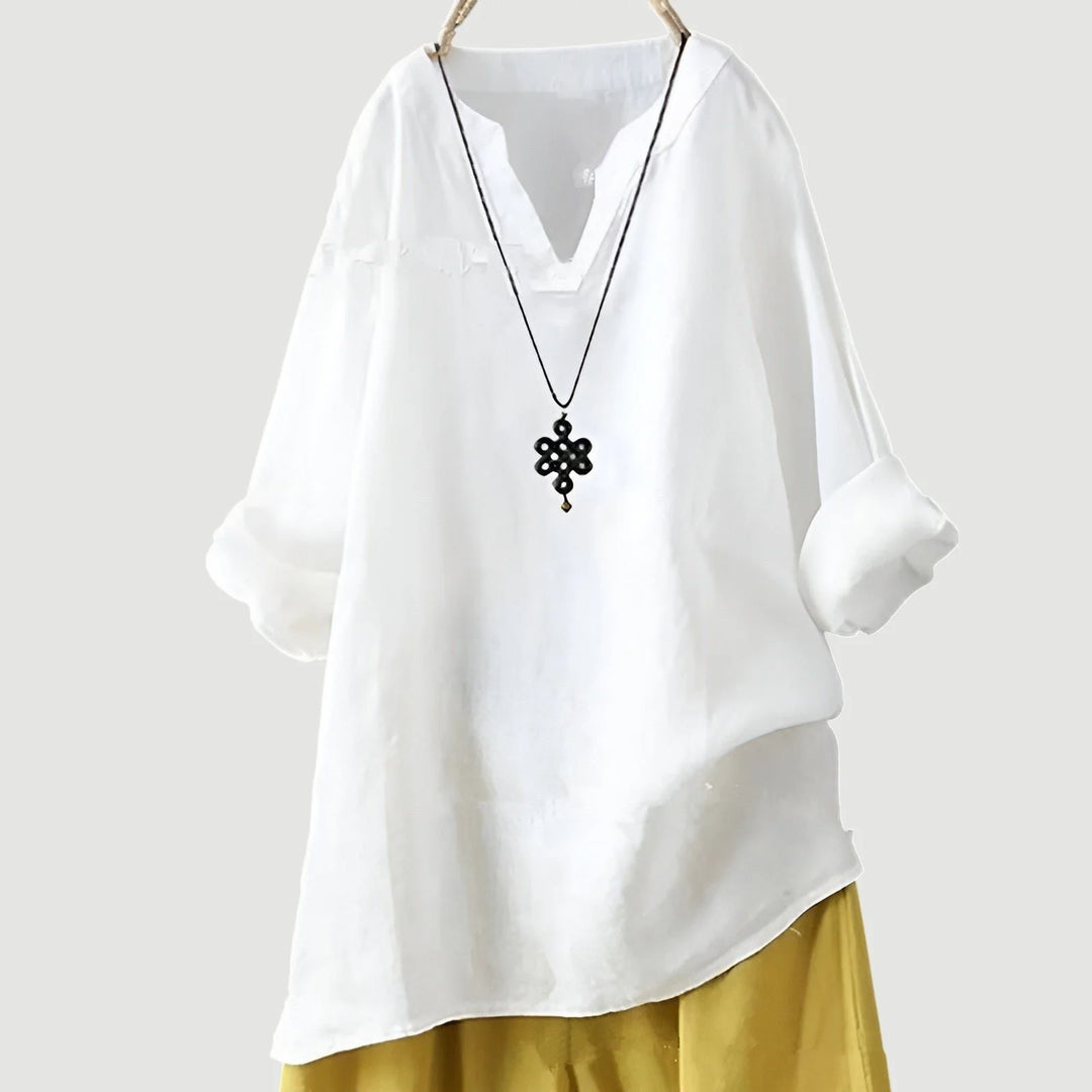 Full-length view of women's V-neck tunic highlighting relaxed fit and versatile casual design