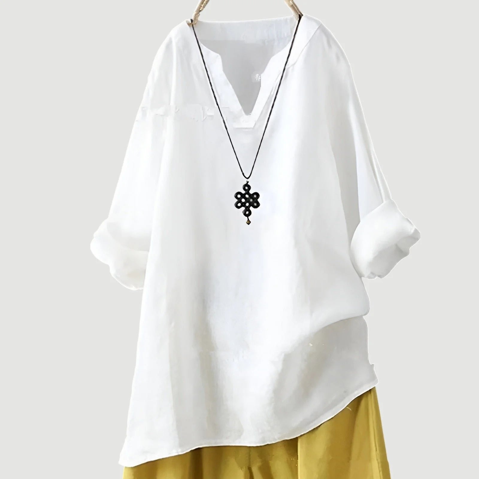 Full-length view of women's V-neck tunic highlighting relaxed fit and versatile casual design