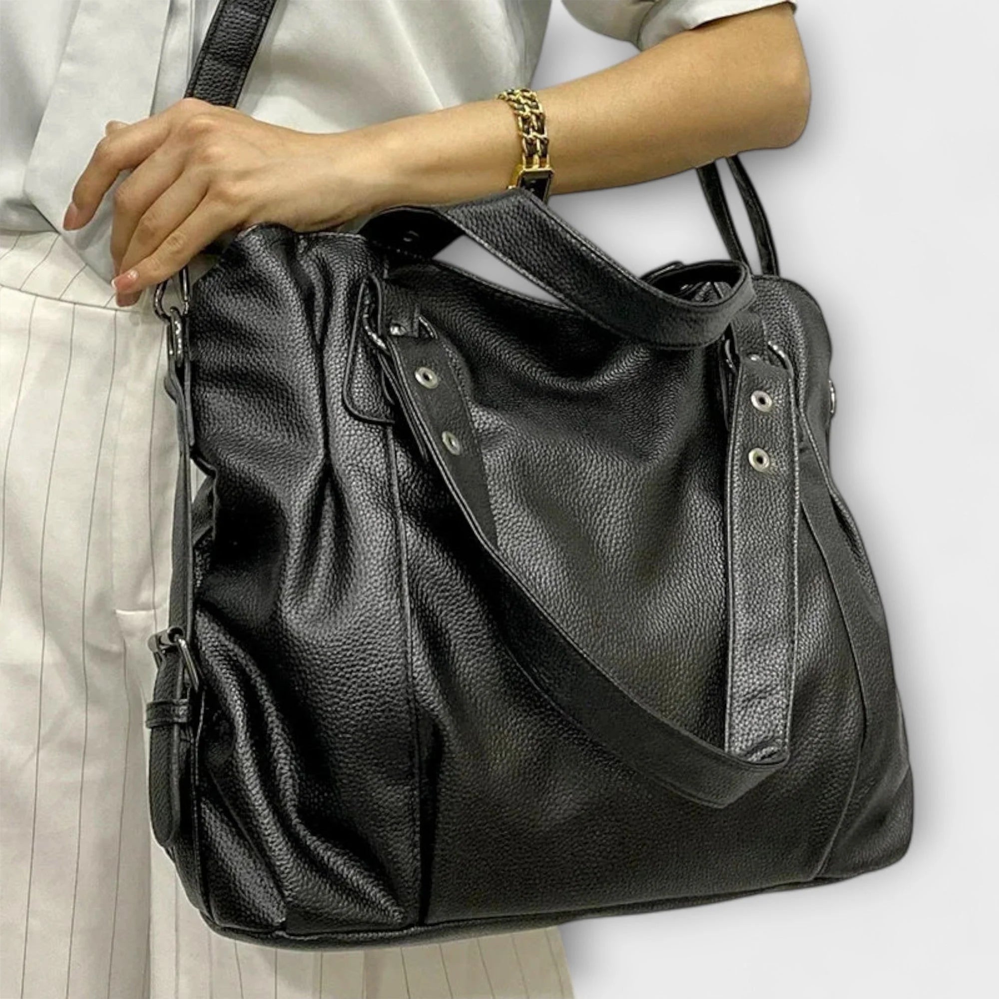 Interior view of hobo bag showing multiple compartments and organisational pockets