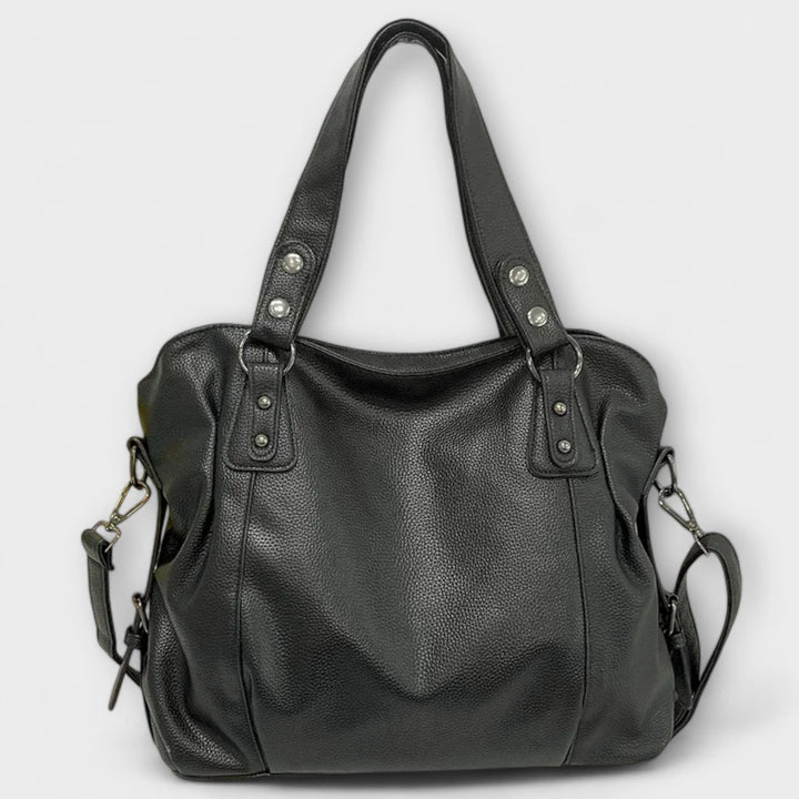 Hobo shoulder bag styled as crossbody with adjustable strap fully extended