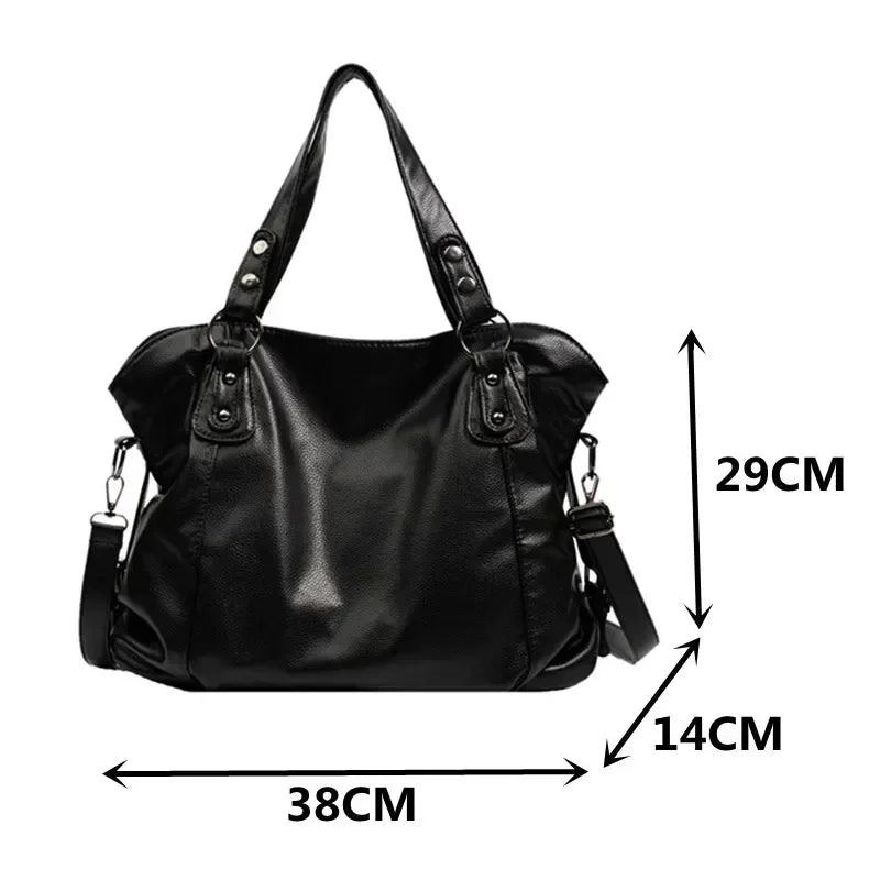 Detail shot of detachable crossbody strap hardware and clasp attachment on hobo bag