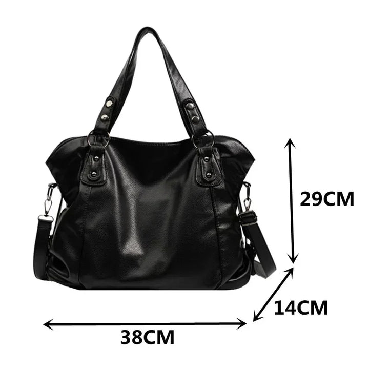 Detail shot of detachable crossbody strap hardware and clasp attachment on hobo bag