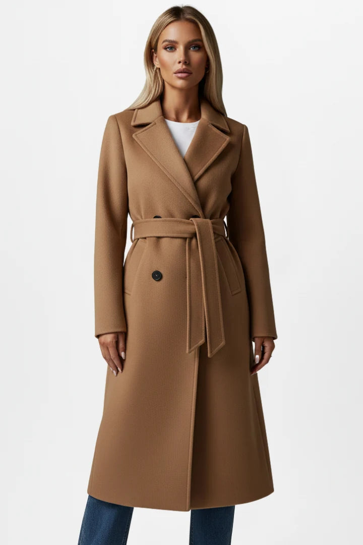 Full-length view of women's belted trench coat highlighting structured fabric and tailored silhouette