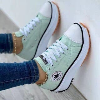 Detail of women's chunky canvas trainers showing lightweight canvas upper and secure lacing