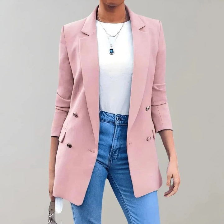 Women's double-breasted blazer in pink with notched lapels and three-quarter sleeves styled with white top