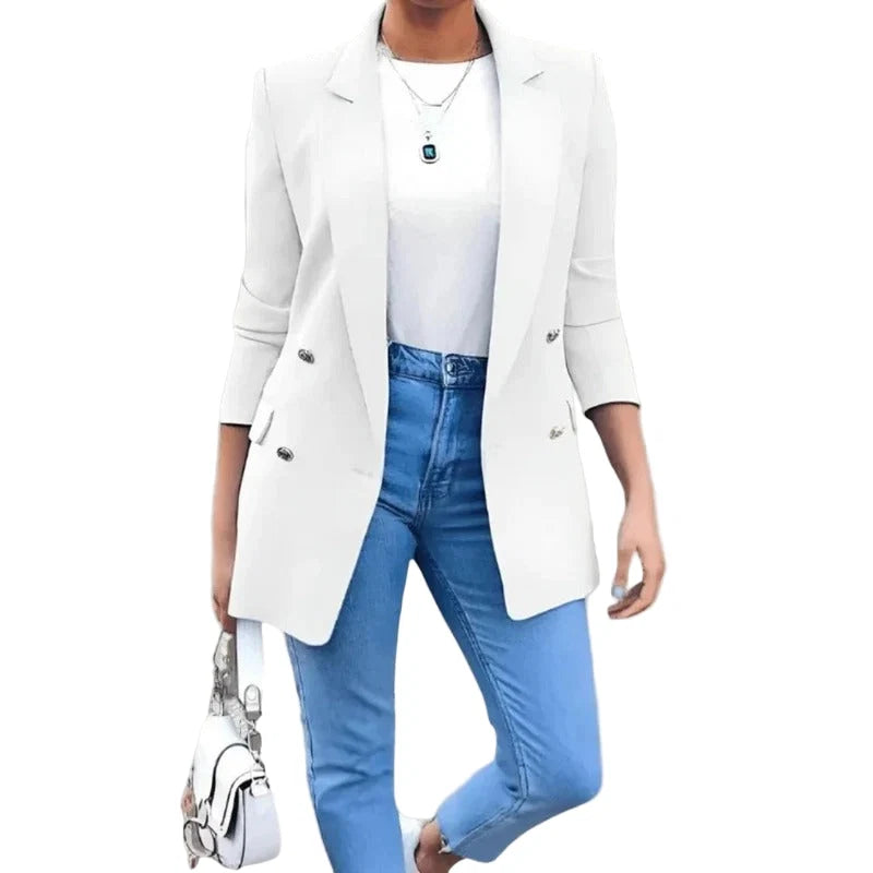 Side profile of women's blazer displaying three-quarter sleeve length and hip-length cut