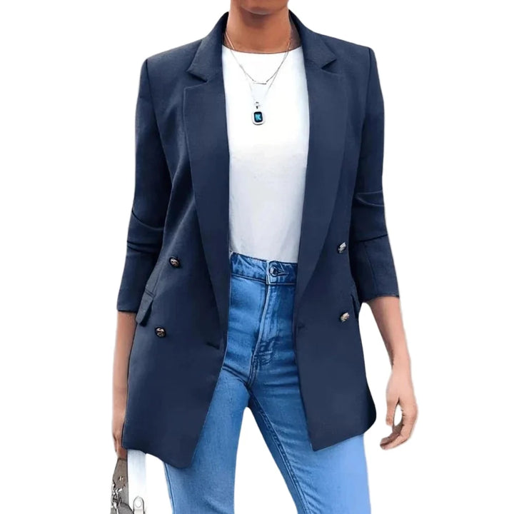 Women's structured blazer paired with blue jeans demonstrating smart-casual styling versatility