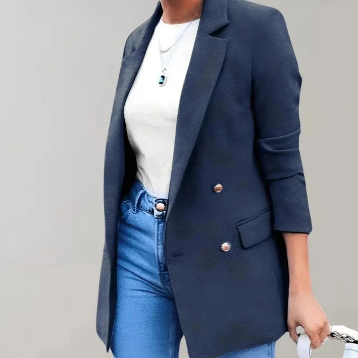Full-length view of longline blazer showing tailored fit and flap pocket detailing
