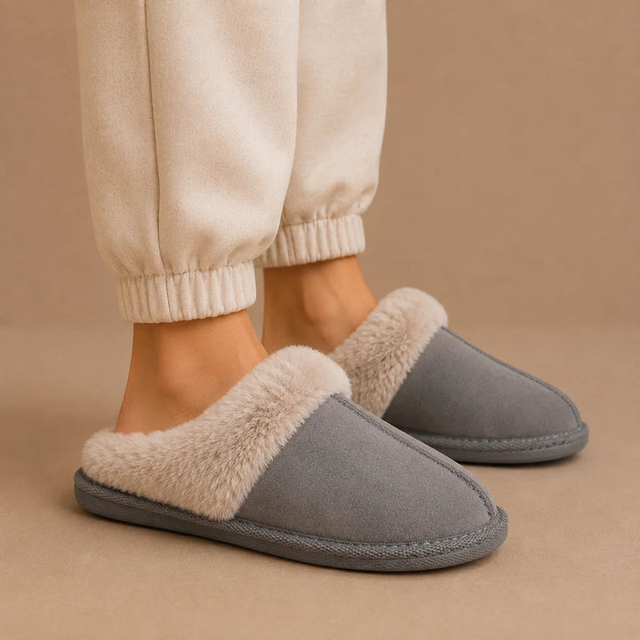 Women's mule slippers styled with neutral loungewear trousers for indoor comfort