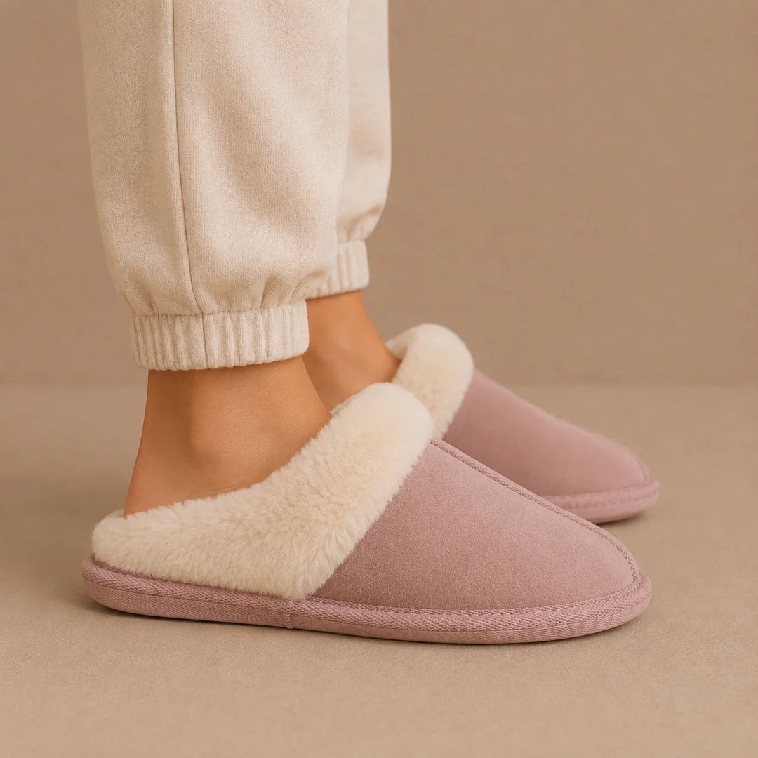 Detailed view of women's mule slippers highlighting suede-effect finish and plush lining