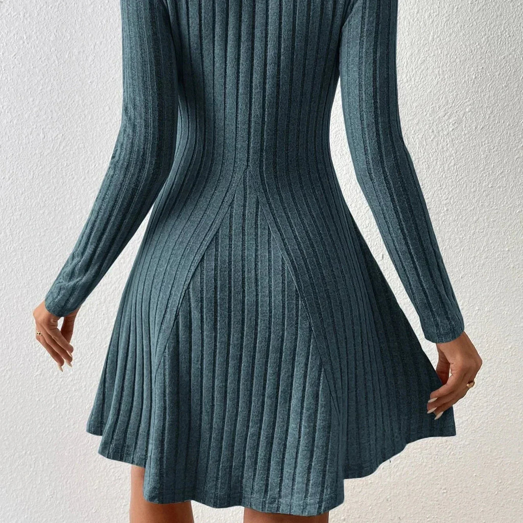 Women's fit and flare dress styled for casual autumn occasion