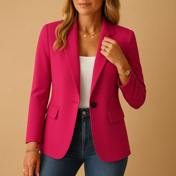 Close-up of women's white blazer showing single button closure and flap pocket detail at hip