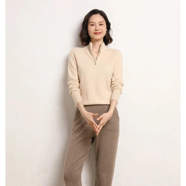 Detail of stand-up collar on women's cashmere zip up jumper in neutral beige