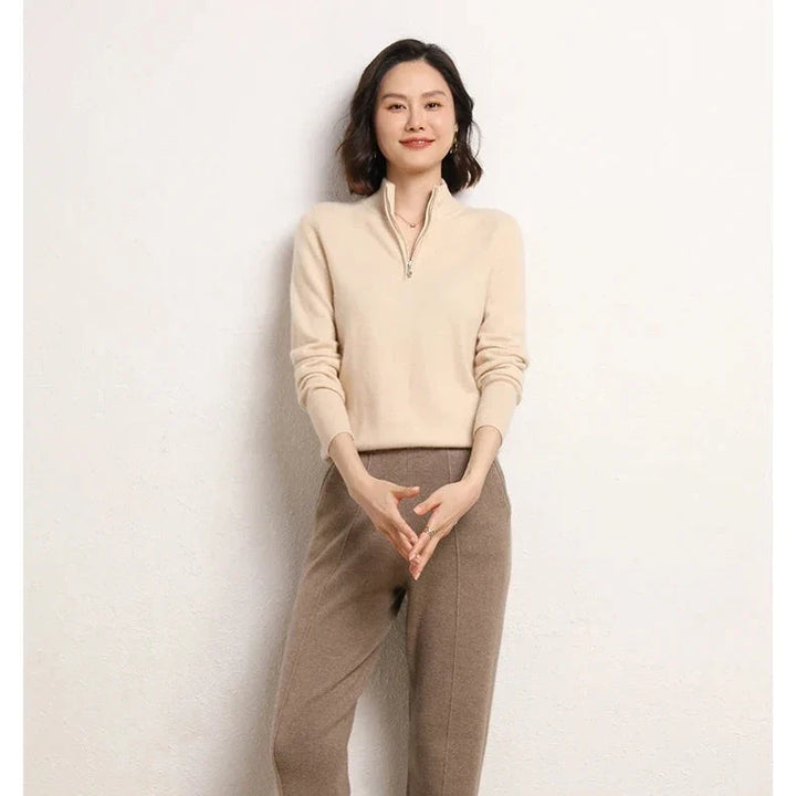 Detail of stand-up collar on women's cashmere zip up jumper in neutral beige