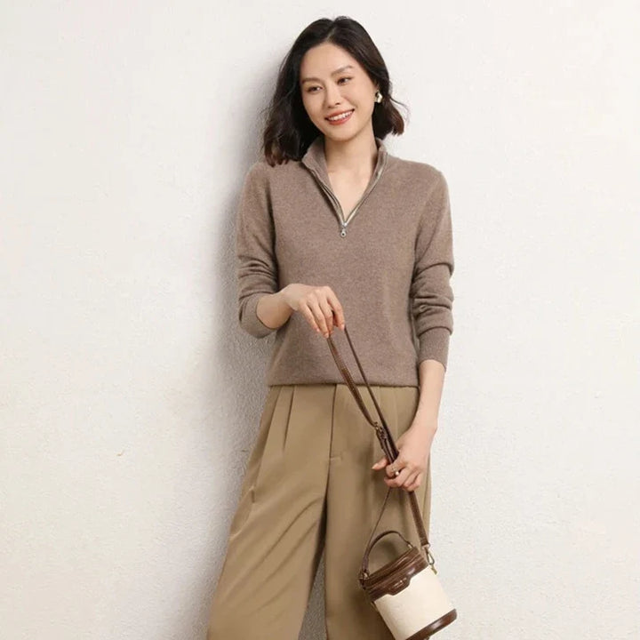 Women's cashmere zip up jumper in beige styled with brown tailored trousers