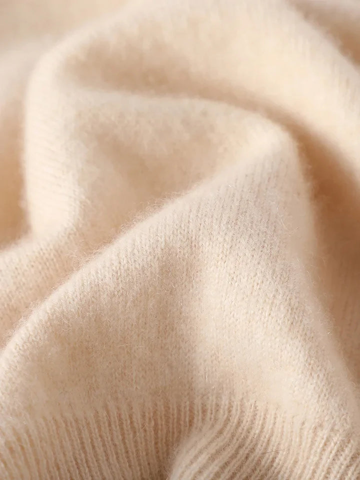 Women's cashmere zip up jumper with zip fully closed showing stand-up collar