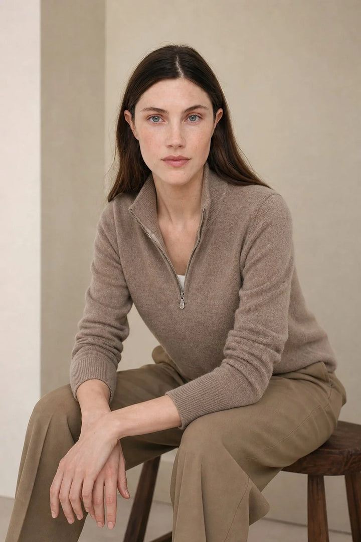 Detail shot of half-zip closure on women's cashmere zip up jumper with metal zipper