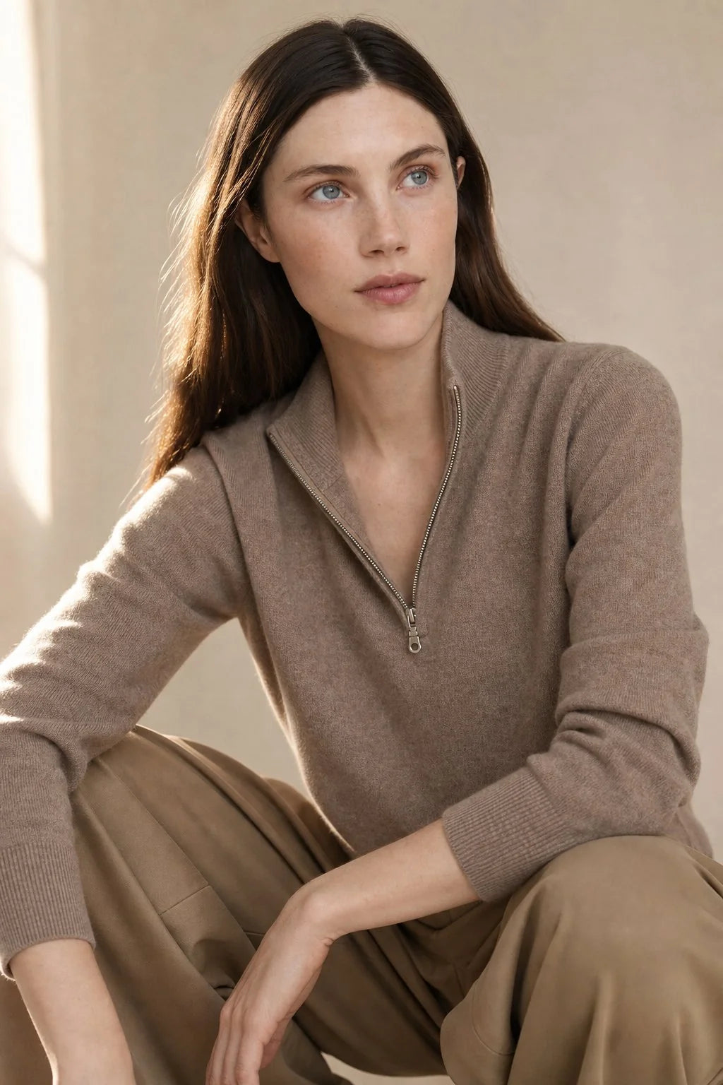 Women's cashmere zip up jumper paired with tailored trousers for casual styling