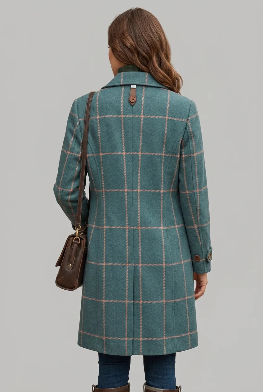 Women's longline check coat detail view with brown button closure and notched lapel design