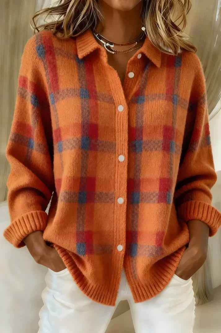 Women's checked cardigan styled with white trousers for casual layering look